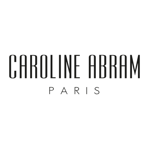 לוגו של מותג משקפיים יוקרתי, "CAROLINE ABRAM", כולל את המילה "PARIS".